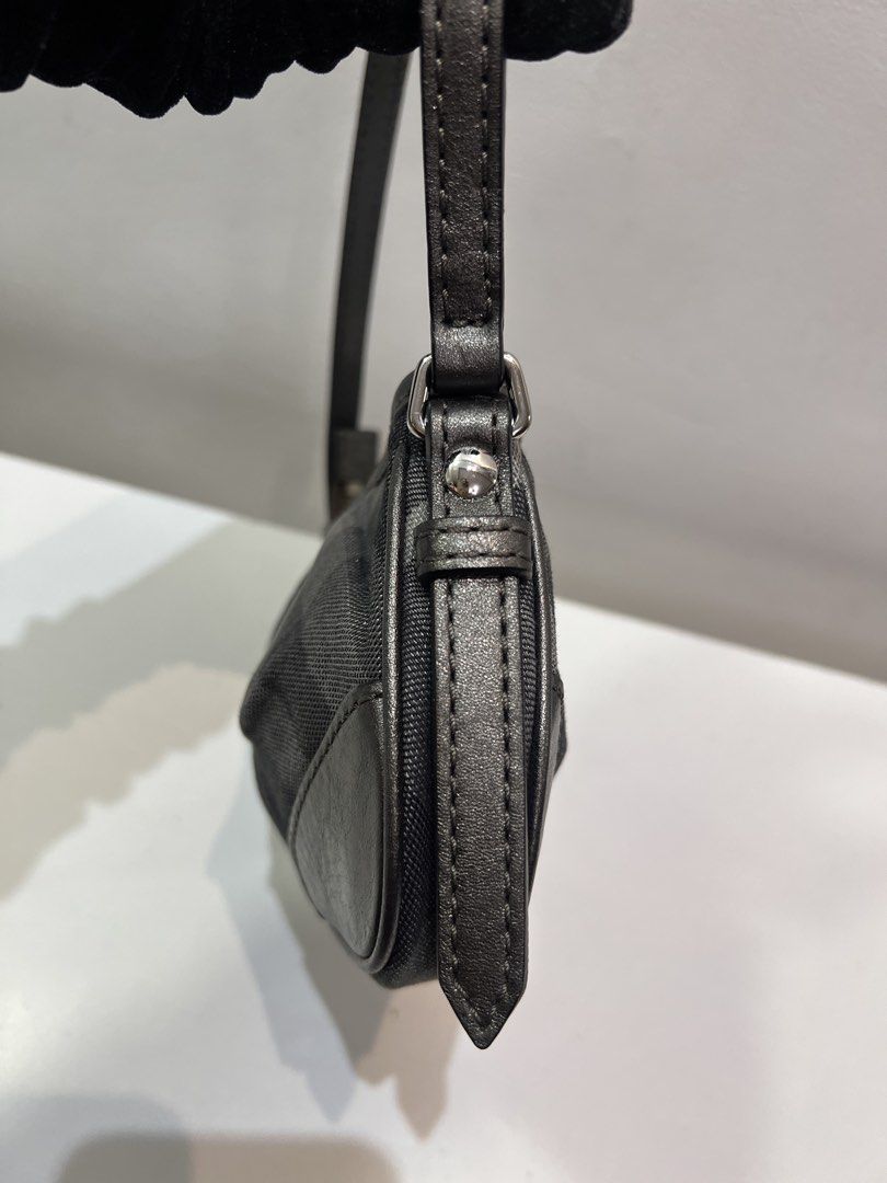 Pre-loved Burberry Glitter Check Baguette Bag (Category: Luxury Bags & Wallets) located in Cebu City. Submitted by brandedcorner_ph (Listing ID 1470923997, Image 3). Description: Pre-loved ((B))urberry Glitter Check Baguette Bag 100% Authentic or money back Condition • Good as new condition • Mo flaws Product Details •Color: Grey •Hardware: Silver tone •Material: Canvas, leather •Approximate Dimensions in inches: H5 x W12 x D1.3 Color may vary du