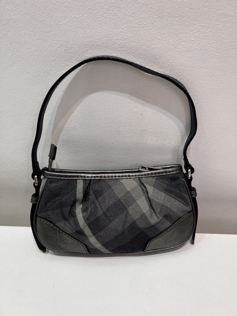 Pre-loved Burberry Glitter Check Baguette Bag (Category: Luxury Bags & Wallets) located in Cebu City. Submitted by brandedcorner_ph (Listing ID 1470923997, Image 2). Description: Pre-loved ((B))urberry Glitter Check Baguette Bag 100% Authentic or money back Condition • Good as new condition • Mo flaws Product Details •Color: Grey •Hardware: Silver tone •Material: Canvas, leather •Approximate Dimensions in inches: H5 x W12 x D1.3 Color may vary du