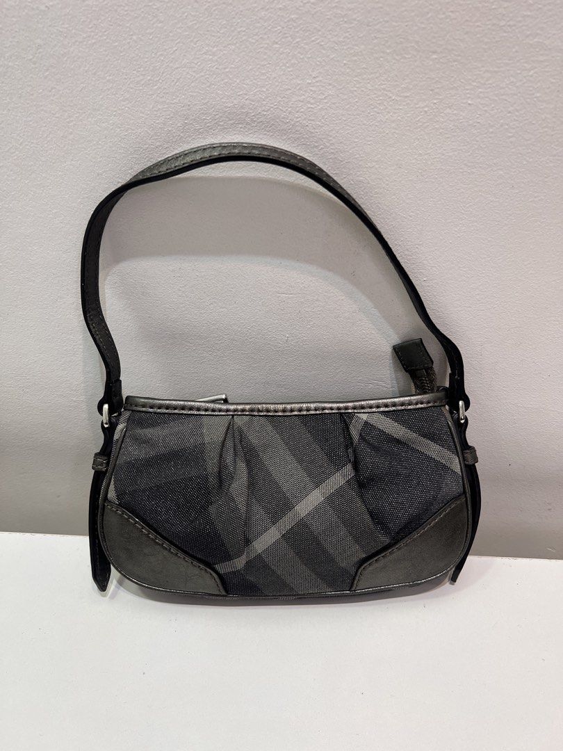 Pre-loved Burberry Glitter Check Baguette Bag (Category: Luxury Bags & Wallets) located in Cebu City. Submitted by brandedcorner_ph (Listing ID 1470923997, Image 1). Description: Pre-loved ((B))urberry Glitter Check Baguette Bag 100% Authentic or money back Condition • Good as new condition • Mo flaws Product Details •Color: Grey •Hardware: Silver tone •Material: Canvas, leather •Approximate Dimensions in inches: H5 x W12 x D1.3 Color may vary du