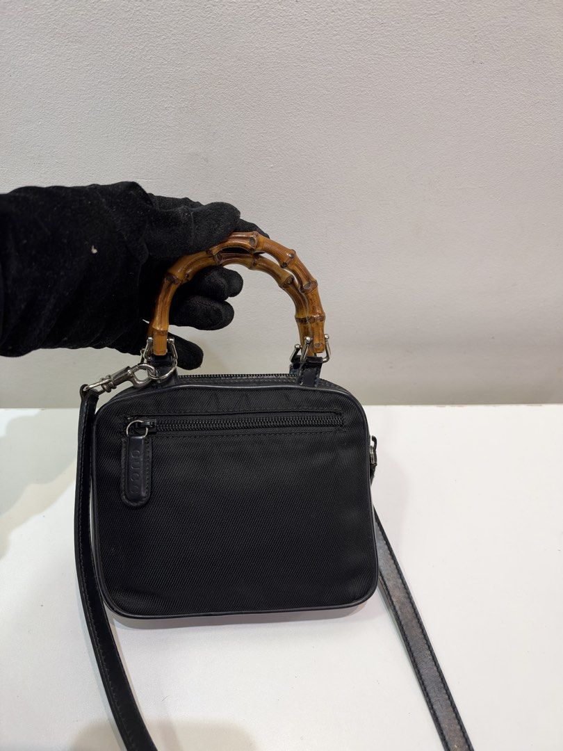 Pre-loved Gucci Bamboo Mini Top Handle Bag (Category: Luxury Bags & Wallets) located in Cebu City. Submitted by brandedcorner_ph (Listing ID 1470922967, Image 2). Description: Pre-loved ((G))ucci Bamboo Mini Top Handle Bag 100% Authentic or money back Condition • Excellent condition • No flaws Product Details •Color: Black •Hardware: Silver tone •Material: Nylon/ leather •Approximate Dimensions in inches: H5.2 x W6.5 x D1.5 Color may vary due to 