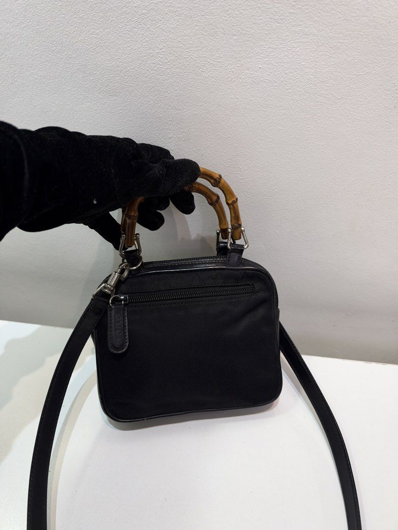 Pre-loved Gucci Bamboo Mini Top Handle Bag (Category: Luxury Bags & Wallets) located in Cebu City. Submitted by brandedcorner_ph (Listing ID 1470922967, Image 1). Description: Pre-loved ((G))ucci Bamboo Mini Top Handle Bag 100% Authentic or money back Condition • Excellent condition • No flaws Product Details •Color: Black •Hardware: Silver tone •Material: Nylon/ leather •Approximate Dimensions in inches: H5.2 x W6.5 x D1.5 Color may vary due to 