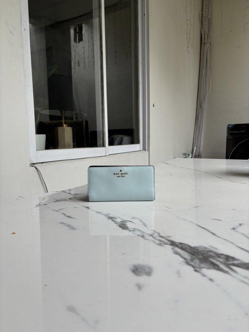 Preloved Kaye Spade Bi-Fold Wallet (Category: Wallets & Card holders) located in Pasig City. Submitted by catsyybooo (Listing ID 1470759149, Image 1). Description: -Unused but stored fir a while, like new condition .