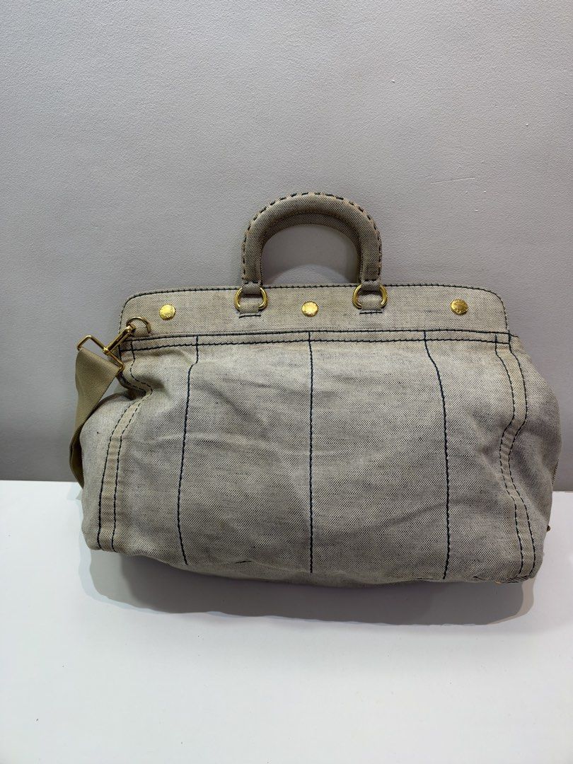 Pre-loved Prada Canapa Canvas Tote Bag (Category: Luxury Bags & Wallets) located in Cebu City. Submitted by brandedcorner_ph (Listing ID 1470922601, Image 2). Description: Pre-loved ((P))rada Canapa Canvas Tote Bag 100% Authentic or money back Condition • In good condition • Sign of usage are posted, check photos • No major flaws Product Details •Color: Light denim •Hardware: Gold tone •Material: Denim •Approximate Dimensions in inches: H12 x W15