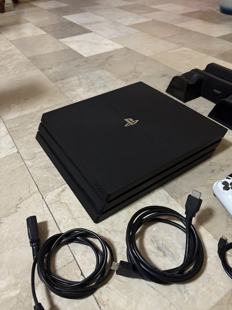 PS4 PRO with games (Category: PlayStation) located in Dasmarinas. Submitted by manga_ (Listing ID 1470915172, Image 2). Description: FOR SALE: PS4 Pro Bundle + 3 Games 🎮 Selling my PS4 Pro! Inclusions: • PS4 Pro console • 1 fake/replacement controller • HDMI cable • Power cable • 3 games: • Star Wars Battlefront • NBA Live 14 • NBA 2K15 • PS4 vertical stand with game disc rack Condition: Used Box: Not included Note: Original controller is broken