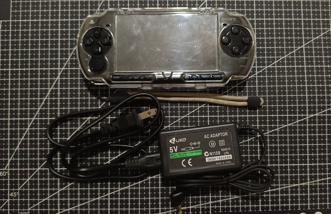PSP 2000 Modded (w/ Crystal Case & Charger) (Category: PlayStation) located in Manila. Submitted by ken.zie (Listing ID 1470876882, Image 1). Description: Selling this PSP 2000 for 2000! In good working condition Comes with crystal case, charger, original battery, and 8GB MicroSD with MS-Pro Duo adapter Modded with Pro-C2 Comes with games and emulators Honest issue: scratch sa may aluminum ng UMD panel lid. No other issues. Payment can be made vi