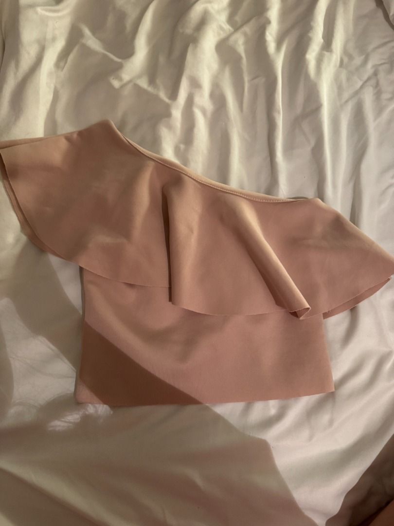 Pull & Bear One-Shoulder Ruffle Crop Top Small (Category: Sleeveless) located in Cebu City. Submitted by _t.rix (Listing ID 1470761693, Image 3). Description: - Brand: Pull & Bear - Item: Pink one-shoulder crop top with big ruffle overlay - Size: S - Material: Stretchy ribbed fabric - Condition: Brand new with tags attached, clean inside and out - Mode of transaction: Shipping or meet-up available (DM to order!).