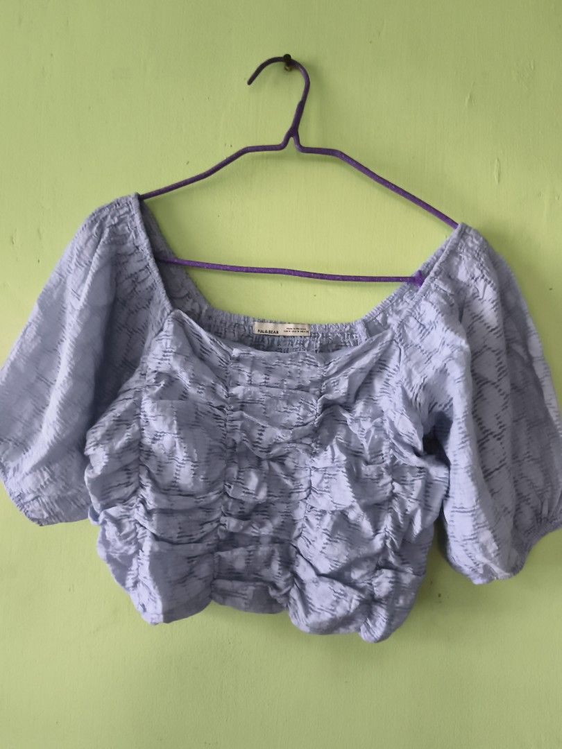 Pull&Bear Light blue Ruched Puff Sleeve Crop Top (Category: Blouses) located in Bulacan. Submitted by jvblaguard08460 (Listing ID 1470751790, Image 1). Description: - Brand: Pull&Bear - Size: M (Fits true to size) - Color: Pastel purple - Material/Pattern: Textured fabric made in Morocco - Details: Square neckline, ruched front & back, short puff sleeves - Styling: Great with high-waisted jeans or skirts.