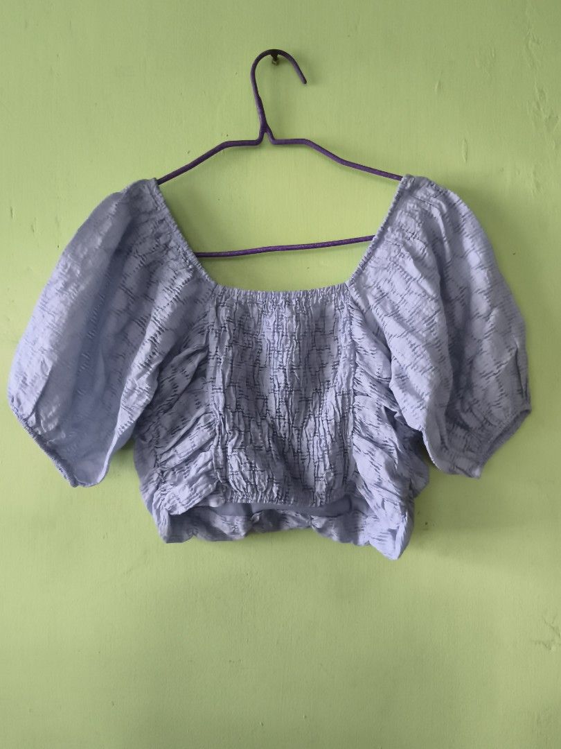 Pull&Bear Light blue Ruched Puff Sleeve Crop Top (Category: Blouses) located in Bulacan. Submitted by jvblaguard08460 (Listing ID 1470751790, Image 3). Description: - Brand: Pull&Bear - Size: M (Fits true to size) - Color: Pastel purple - Material/Pattern: Textured fabric made in Morocco - Details: Square neckline, ruched front & back, short puff sleeves - Styling: Great with high-waisted jeans or skirts.