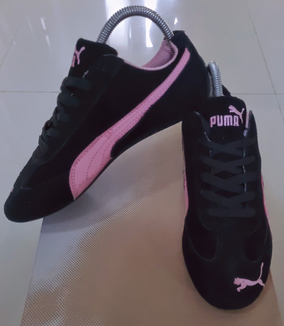 Puma Black and Pink Suede Sneakers (Category: Sneakers) located in Danao, Cebu. Submitted by CaxeCart (Listing ID 1470846018, Image 1). Description: - Brand: Puma - Colorway: Black and Pink with suede finish - Design: Pink formstrip, embroidered logos on tongue, heel, and toe - Closure: Classic lace-up with black laces - Comfort: Padded pink inner lining - Sole: Textured black rubber outsole wrapping the heel - Condition: Clean soles, well-mainta