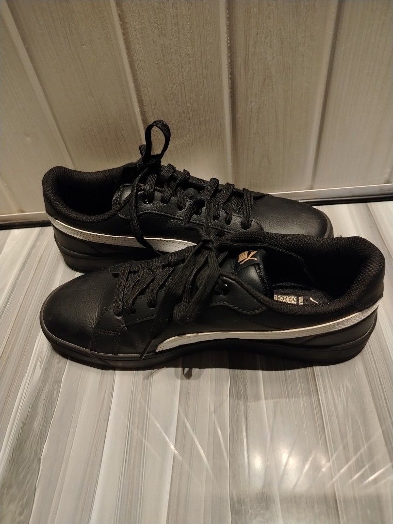 Puma Grounded SL II (black, white, gold) (Category: Sneakers) located in Quezon City. Submitted by stacey_bluey (Listing ID 1470810098, Image 2). Description: - Brand: Puma - Color: Black leather with white side stripes - Details: Gold Puma branding on side, tongue, and heel - Original Puma sneakers - Closure: Lace-up with black laces - Condition: Soles show minimal wear with fully intact tread, clean interior lining - Features: QR code printed o
