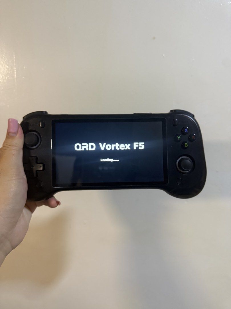 QRD Vortex F5 Handheld Game Console (Category: Nintendo) located in Daet. Submitted by shandra21 (Listing ID 1470908600, Image 1). Description: QRD Vortex F5 handheld console in black. Fully working, great for retro gaming on the go, and ready to use. SPECS: 1GB RAM 5000mAh 5.5 hd ips display comes with 128gb SD with free 20k+++ offlien games. retro to PSP.