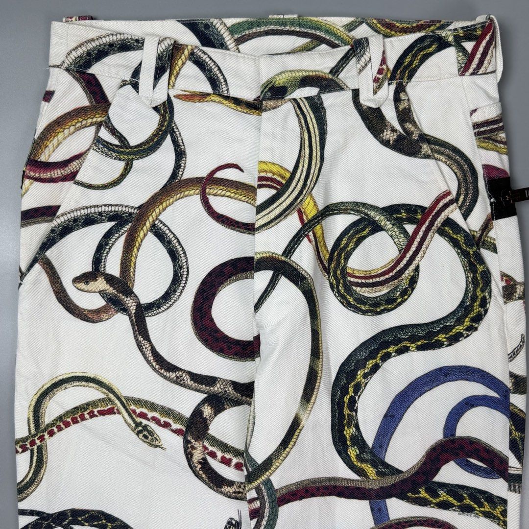 Raf Simons - S/S10 - Snake Pants (Category: Chinos) located in Pasig City. Submitted by on_the_trend (Listing ID 1470807111, Image 3). Description: Tagged size: 44 Condition: 8.5/10 Flaws: Minor color bleeding, Minor yellow stain Made in: Italy Measurement: Waist: 15 inches Front rise: 12 inches Thigh: 11 inches Knee: 8.5 inches Inseam: 30 inches Length: 42 inches Leg opening: 8.5 inches.