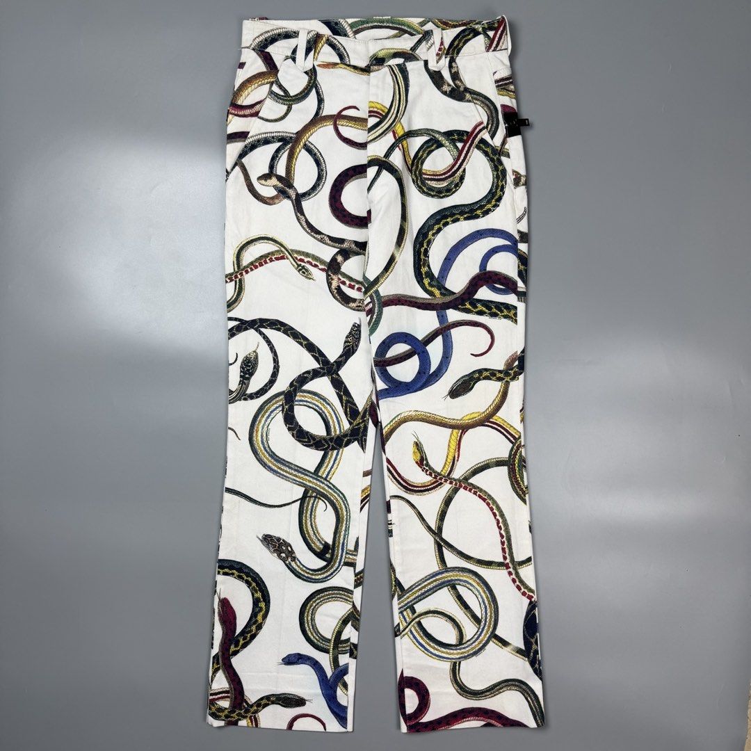 Raf Simons - S/S10 - Snake Pants (Category: Chinos) located in Pasig City. Submitted by on_the_trend (Listing ID 1470807111, Image 1). Description: Tagged size: 44 Condition: 8.5/10 Flaws: Minor color bleeding, Minor yellow stain Made in: Italy Measurement: Waist: 15 inches Front rise: 12 inches Thigh: 11 inches Knee: 8.5 inches Inseam: 30 inches Length: 42 inches Leg opening: 8.5 inches.