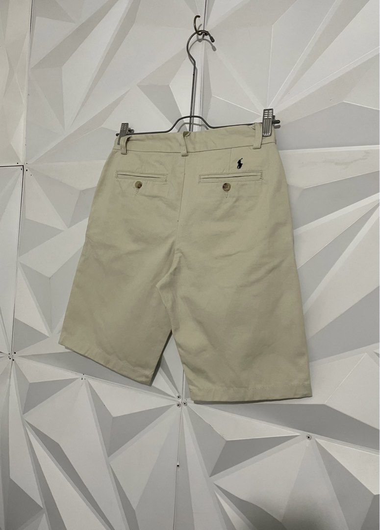 Ralph Lauren Beige Chino Shorts (Category: Shorts) located in Cabuyao City. Submitted by ParadisethriftedPh (Listing ID 1470923943, Image 2). Description: Cr: 9.5/10 Dimensions Waist: 26-28 Lenght: 18 - Brand: Polo Ralph Lauren - Color: Classic Beige - Size: 14 - Material: 100% Cotton (Made in China) - Style: Chino shorts with button closure and back pockets - Details: Signature embroidered pony logo on the back right - Condition: Clean and well-