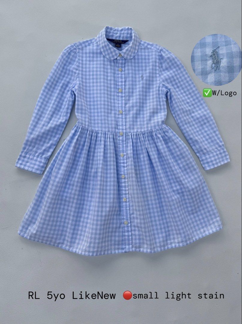 Ralph Lauren Blue Gingham Dress 5yo (Category: Babies & Kids Fashion) located in Pozorrubio. Submitted by izaykite2g (Listing ID 1470768216, Image 1). Description: - Brand: Polo Ralph Lauren - Item: Gingham Check Dress with Peter Pan Collar - Color: Classic Blue & White - Size: Fits 5 years old - Features: Long sleeves, embroidered chest pony logo, front button closure, gathered waistline - Flaw Note: Small light stain near the hem (barely notice