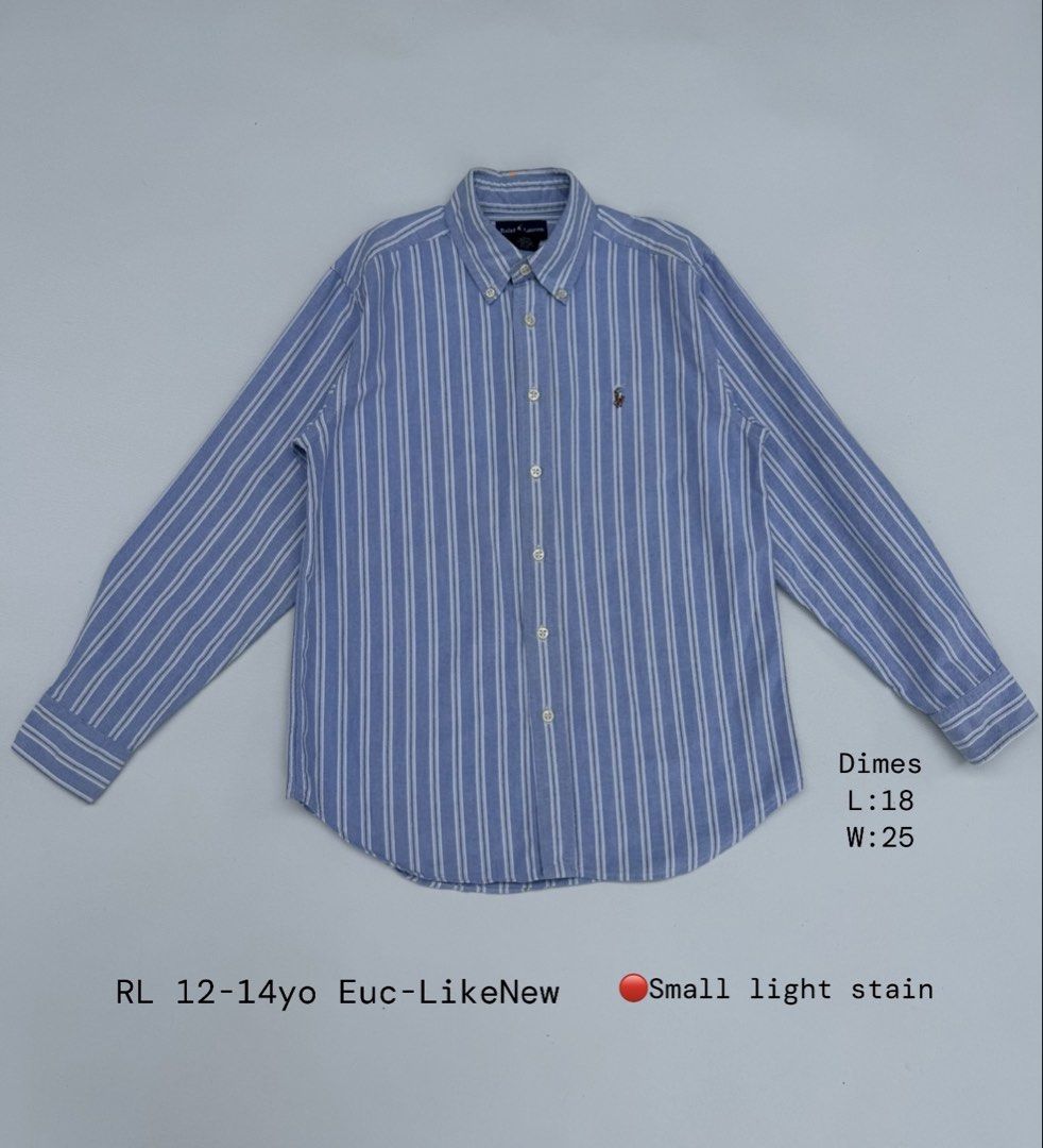 Ralph Lauren Blue Striped Button Down Shirt 12-14yo (Category: Announcements) located in Pozorrubio. Submitted by izaykite2g (Listing ID 1470760985, Image 1). Description: - Brand: Ralph Lauren - Design: Blue with white stripes, long sleeves, classic collar - Logo: Signature embroidered polo pony on the chest - Size: 12-14 years old - Measurements: Length 18" | Width 25" - Condition: Pre-loved with a small, light stain on the fabric (please manag