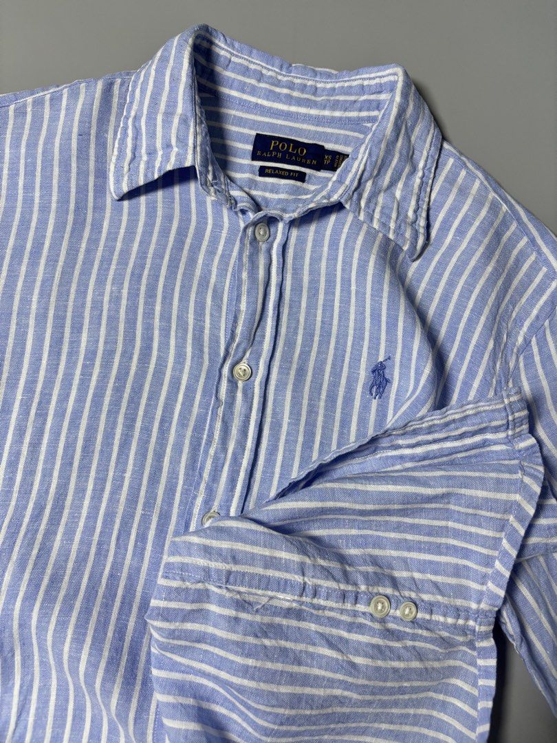 Ralph Lauren Blue Striped Button Down ( linen fabric ) (Category: Formal Shirts) located in Pulilan. Submitted by dmappareal (Listing ID 1470891301, Image 3). Description: Ralph Lauren Blue Striped Button Down ( linen fabric ) 19 x 25 XS on tag Excellent - Like new condition Issue : lints & cut washtag ( guaranteed authentic ) ₱ 2,000.