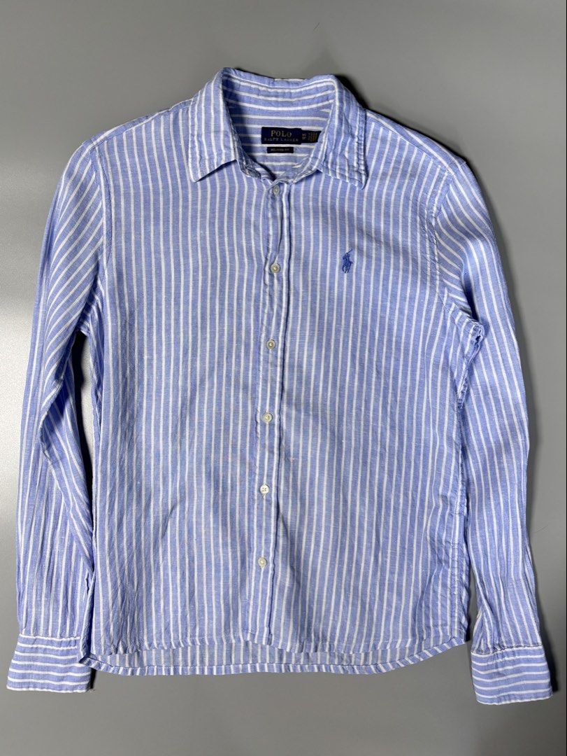 Ralph Lauren Blue Striped Button Down ( linen fabric ) (Category: Formal Shirts) located in Pulilan. Submitted by dmappareal (Listing ID 1470891301, Image 1). Description: Ralph Lauren Blue Striped Button Down ( linen fabric ) 19 x 25 XS on tag Excellent - Like new condition Issue : lints & cut washtag ( guaranteed authentic ) ₱ 2,000.
