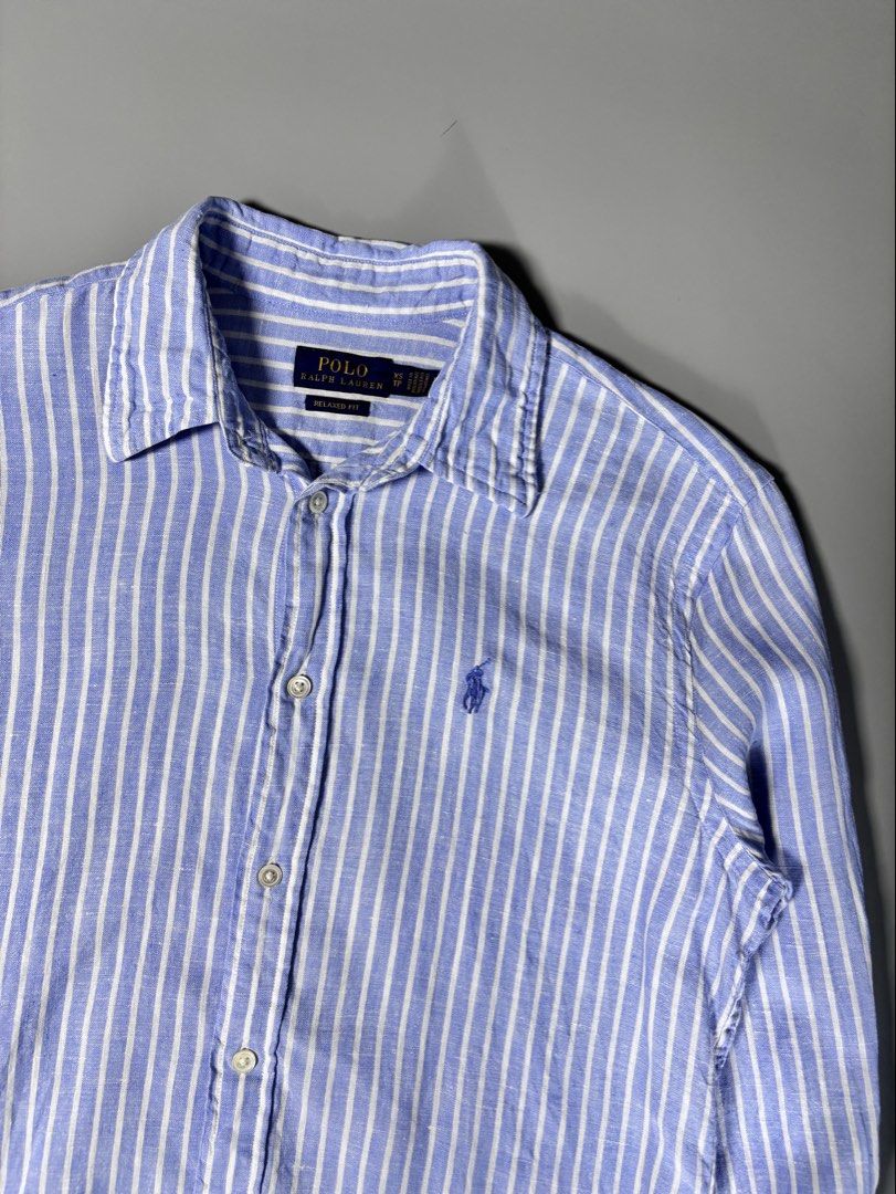 Ralph Lauren Blue Striped Button Down ( linen fabric ) (Category: Formal Shirts) located in Pulilan. Submitted by dmappareal (Listing ID 1470891301, Image 2). Description: Ralph Lauren Blue Striped Button Down ( linen fabric ) 19 x 25 XS on tag Excellent - Like new condition Issue : lints & cut washtag ( guaranteed authentic ) ₱ 2,000.