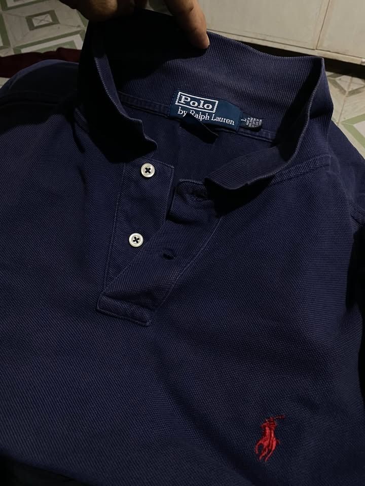 Ralph Lauren Mesh Navy Blue (Category: Tshirts & Polo Shirts ) located in Caloocan City. Submitted by lthrifts993 (Listing ID 1470850244, Image 3). Description: Ralph Lauren Mesh Navy Blue 22.5x28 Color Rate: 8.5/10 Issue: Slits.