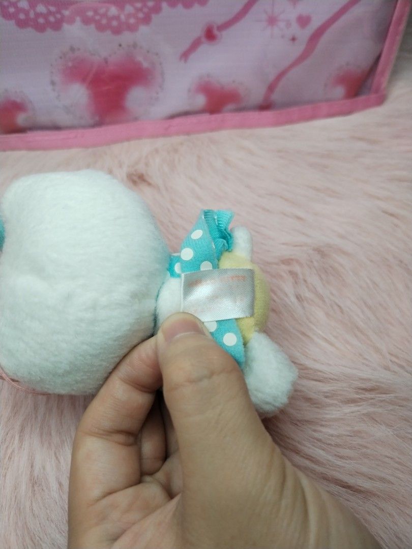 Rare Sanrio Hello Kitty (Category: Plushies & Soft Toys) located in Paombong. Submitted by eandj.shop (Listing ID 1470887297, Image 3). Description: 🎀 As is 🎀 Authentic Kitty mini plush keychain 🎀 Wearing a charming turquoise dress with white polka dots 🎀 Adorned with a striped yellow and blue bow on one ear and a pink bow on the other.