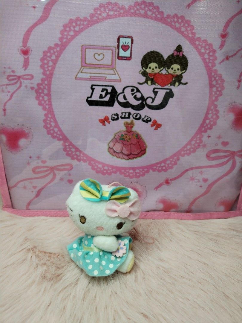Rare Sanrio Hello Kitty (Category: Plushies & Soft Toys) located in Paombong. Submitted by eandj.shop (Listing ID 1470887297, Image 1). Description: 🎀 As is 🎀 Authentic Kitty mini plush keychain 🎀 Wearing a charming turquoise dress with white polka dots 🎀 Adorned with a striped yellow and blue bow on one ear and a pink bow on the other.