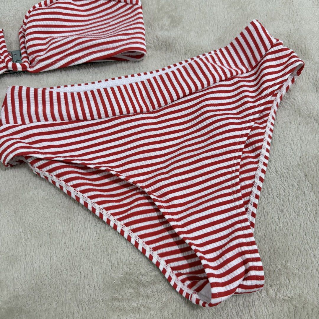Red and White Striped Ribbed Two-Piece Bikini (Category: Bikinis & Swimsuits) located in Manila. Submitted by kbm._. (Listing ID 1470929746, Image 3). Description: - Red and white striped ribbed bikini set - Two-piece design with adjustable straps and front clasp closure - Matching high-waisted bottoms for a cute retro look - Soft, stretchy, and comfortable material - Perfect for swimming, pool days, and vacations.