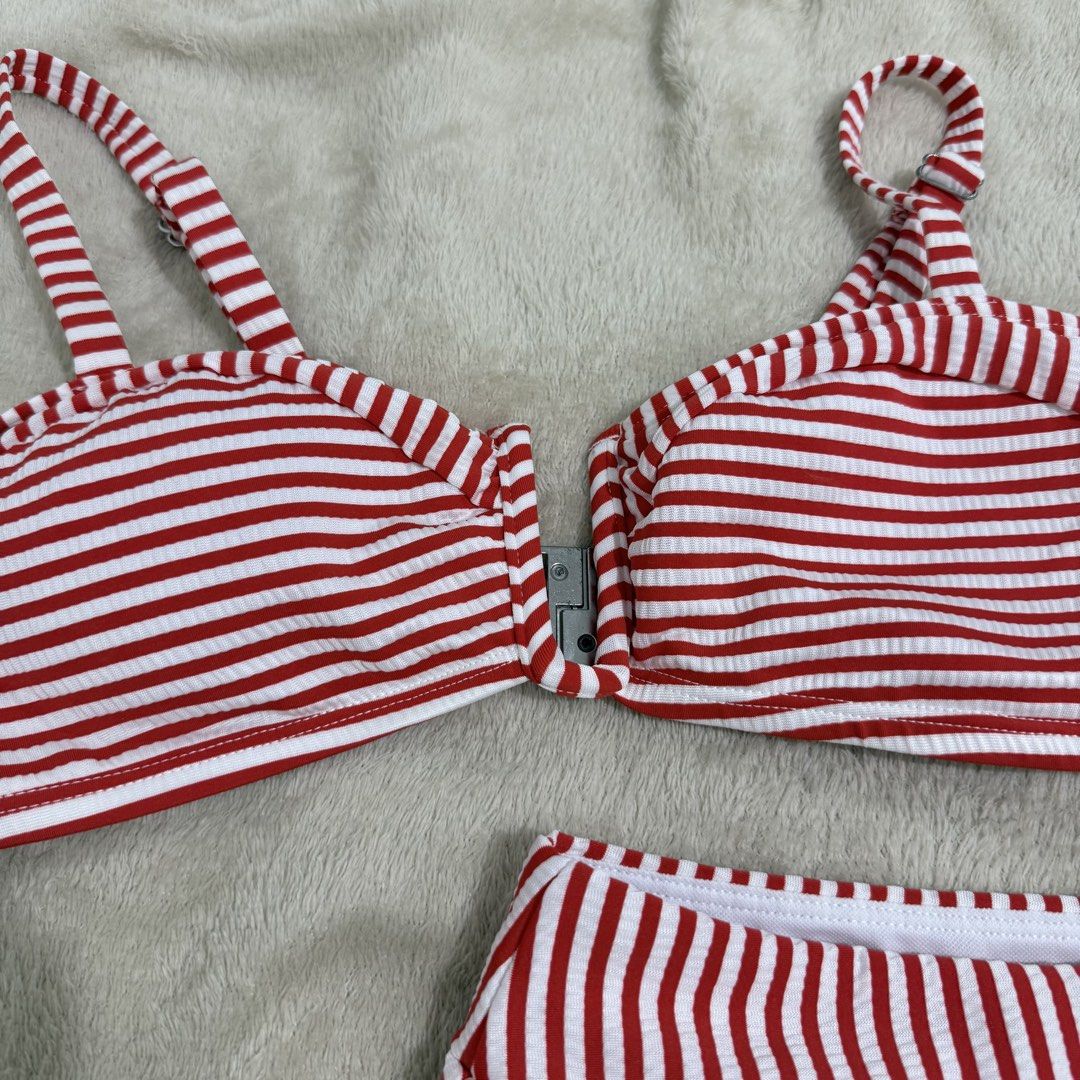 Red and White Striped Ribbed Two-Piece Bikini (Category: Bikinis & Swimsuits) located in Manila. Submitted by kbm._. (Listing ID 1470929746, Image 2). Description: - Red and white striped ribbed bikini set - Two-piece design with adjustable straps and front clasp closure - Matching high-waisted bottoms for a cute retro look - Soft, stretchy, and comfortable material - Perfect for swimming, pool days, and vacations.