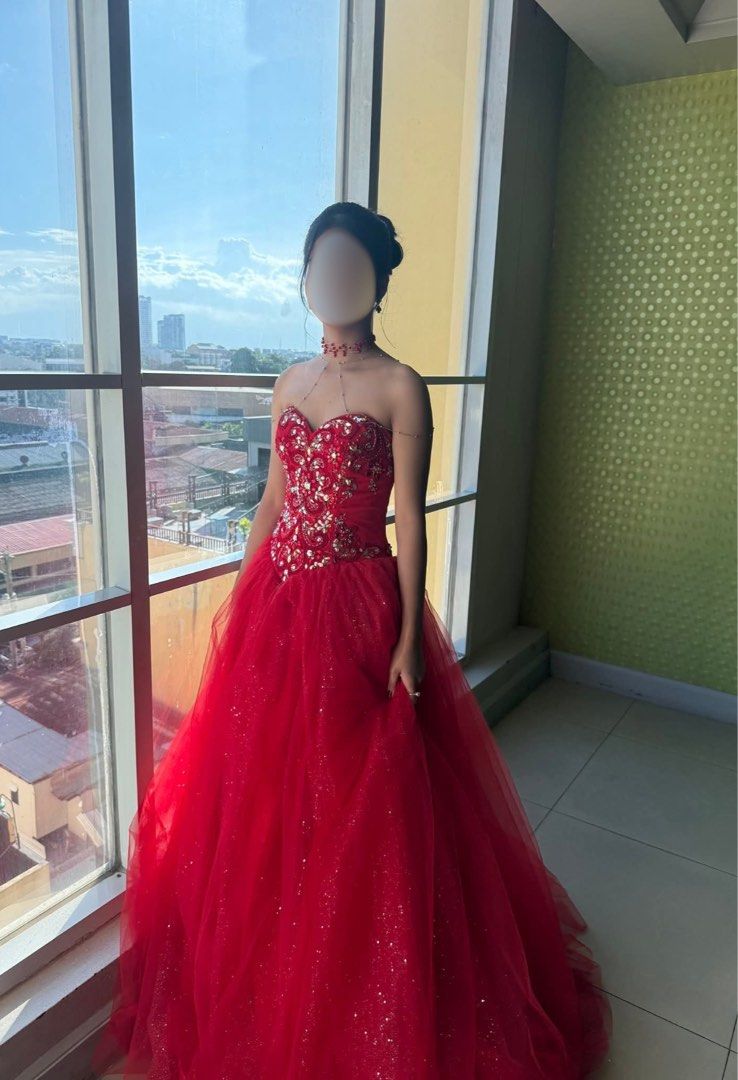 Red Ball Gown For Sale (Category: Evening dresses & gowns) located in Davao. Submitted by yvnsell (Listing ID 1470754512, Image 2). Description: Stunning vibrant red ball gown / quinceañera dress, perfect for proms, pageants, or formal parties. • Design & Details: Sweetheart neckline with intricate red floral lace appliques, dazzling iridescent rhinestones, and beads densely embellished across the bodice. • Skirt: Voluminous, multi-layered tulle 