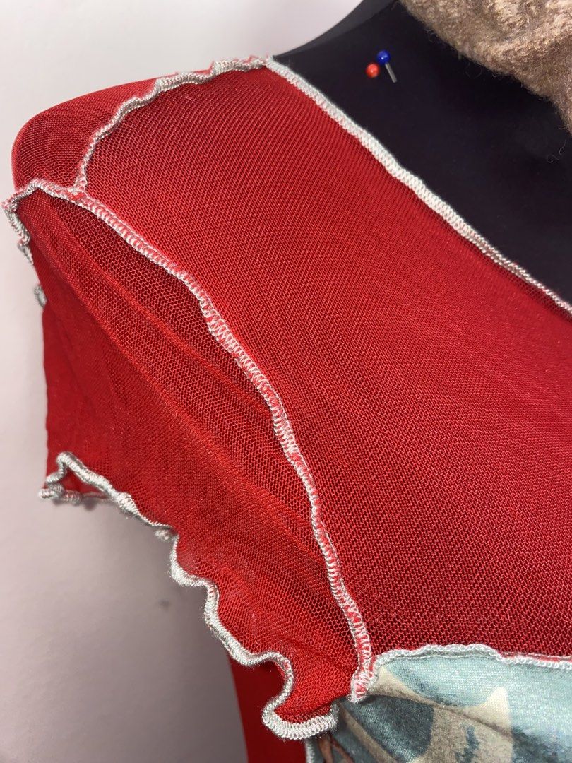 Red Graphic Mesh Top with Lettuce Trim (Category: Shirts) located in Pasay City. Submitted by violetttttttttttttt (Listing ID 1470820358, Image 3). Description: - Color: Bright red with contrasting white exposed stitching - Design: Vintage portrait graphic with "CLASSIC" text - Details: Sheer mesh fabric, trendy lettuce edge hems, scoop neckline - Fit: Slim fit, short sleeves, lightweight and stretchy material - Condition: Brand new / Excellent -
