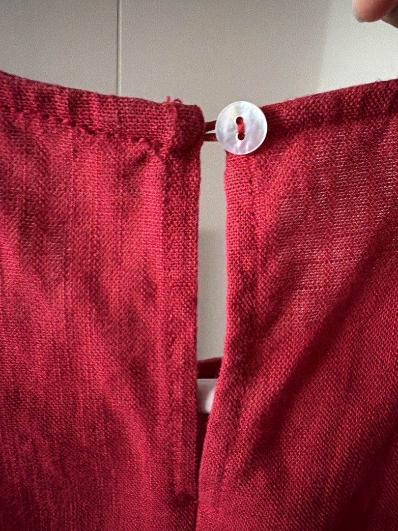 Red Sleeveless Crop Top with Ruffle Hem (Category: Sleeveless) located in Manila. Submitted by shopwt.anna (Listing ID 1470819480, Image 2). Description: - Color: Bright red - Style: Sleeveless cropped top with a cute ruffled hem - Material: Textured linen-like fabric - Details: Round neckline with a back button keyhole closure - Condition: Clean and ready to wear - Perfect to pair with high-waisted jeans or skirts for casual days.
