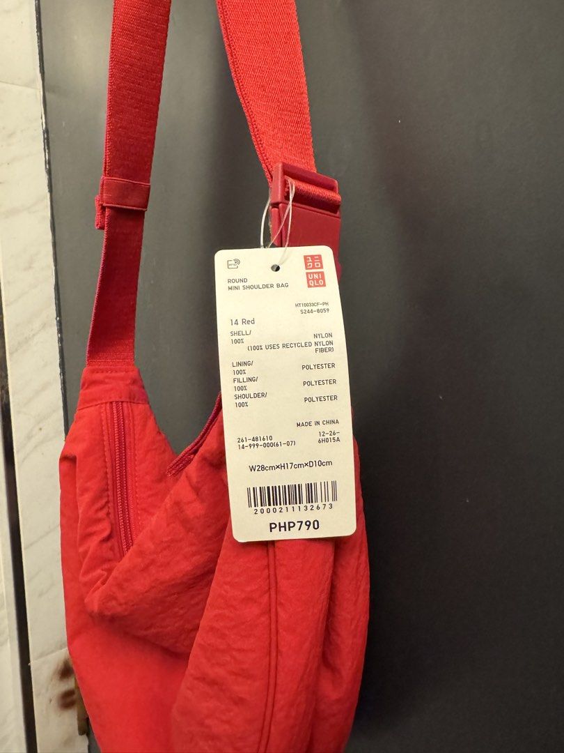 Red Uniqlo Round Mini Shoulder Bag (Category: Cross-body Bags) located in Makati City. Submitted by 099baby (Listing ID 1470876298, Image 3). Description: Brand new Uniqlo Round Mini Shoulder Bag in Red with original tags. Made of durable nylon with a zipper, adjustable strap, and interior pockets. Dimensions: W 28cm x H 17cm x D 10cm. Brand new with tags.