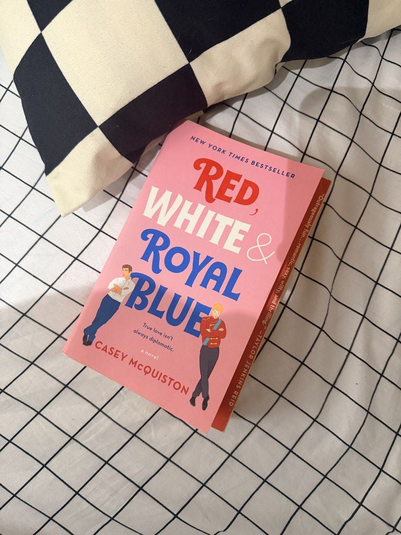 Red, White & Royal Blue by Casey McQuiston (Category: Storybooks) located in Manila. Submitted by augustezr25275 (Listing ID 1470786193, Image 1). Description: - Title: Red, White & Royal Blue by Casey McQuiston - Edition: New York Times Bestseller paperback - Genre: Romantic comedy (US President's son x British prince) - Condition: Spine intact, clean cover, with natural yellowing and slight foxing on edges from storage - Perfect for rom-com and