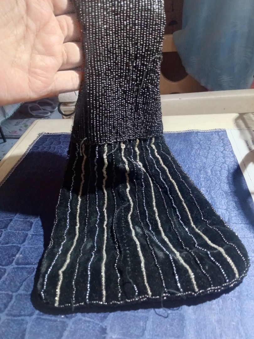 Retro Black Beaded Velvet Wrist Bag (Category: Purses & Pouches) located in Marikina City. Submitted by picker_seller17 (Listing ID 1470800941, Image 2). Description: - Material: Black velvet covered in tiny black and silver beads - Design: Vertical striped pattern with a fully beaded handle - Style: Small pouch, ideal for evening events, dates, or dinners - Capacity: Comfortably fits keys, lipstick, and cards - Condition: Impeccably clean inside