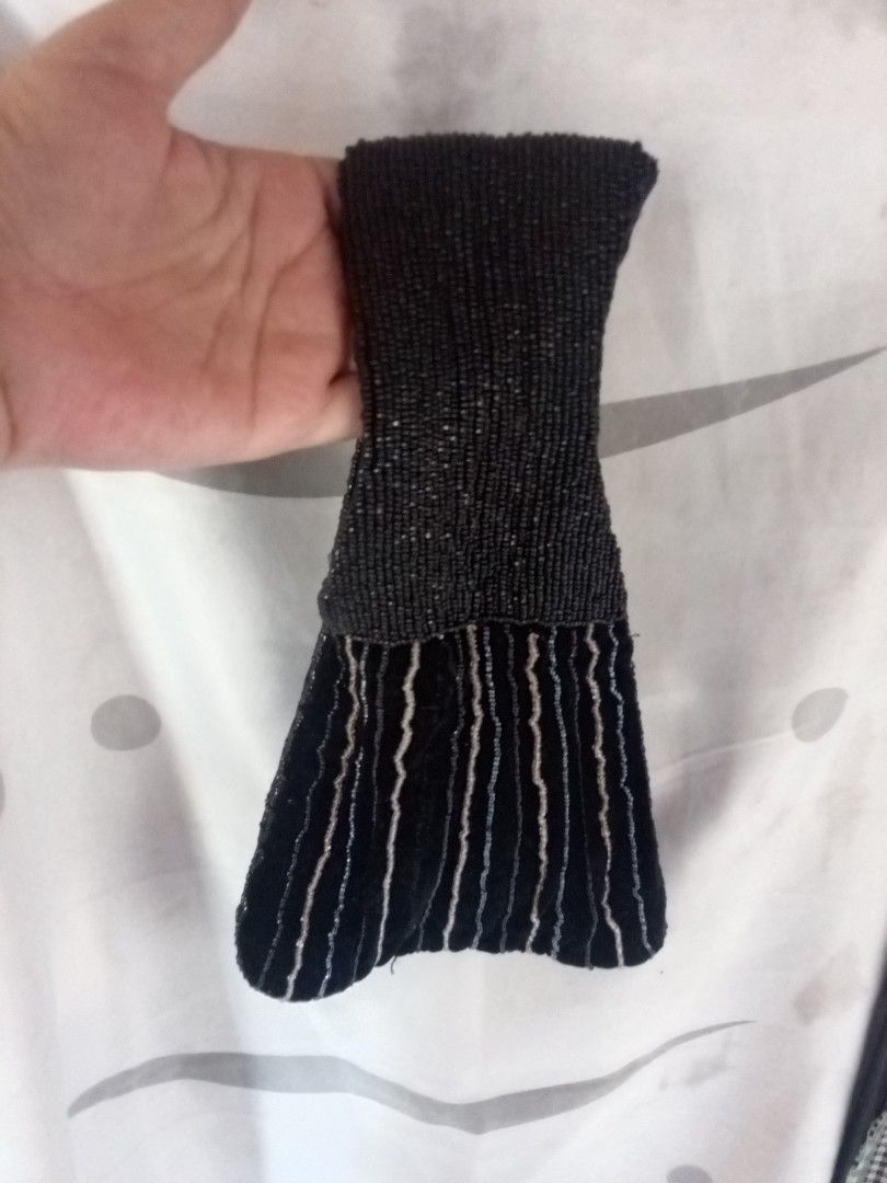 Retro Black Beaded Velvet Wrist Bag (Category: Purses & Pouches) located in Marikina City. Submitted by picker_seller17 (Listing ID 1470800941, Image 3). Description: - Material: Black velvet covered in tiny black and silver beads - Design: Vertical striped pattern with a fully beaded handle - Style: Small pouch, ideal for evening events, dates, or dinners - Capacity: Comfortably fits keys, lipstick, and cards - Condition: Impeccably clean inside