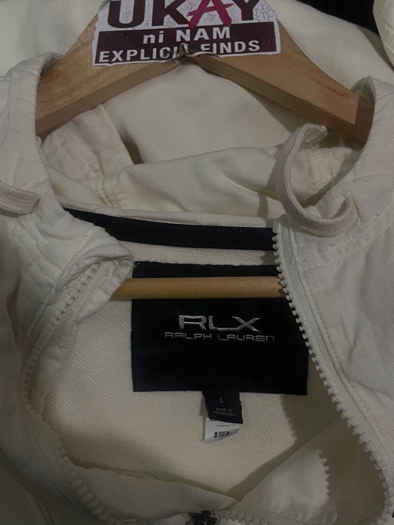 RLX Ralph Lauren 02 Unit Technical Hoodie White (Category: Coats, Jackets and Outerwear) located in Nampicuan. Submitted by aireann_10 (Listing ID 1470859863, Image 3). Description: RLX Ralph Lauren technical knitwear hoodie in crisp white. Size large fits standard. Bold 02 Unit and performance cotton graphics on the front pouch pocket. Half-zip neck with drawstring hood, plus zippered side pockets. Ribbed cuffs and hem keep the shape structured.