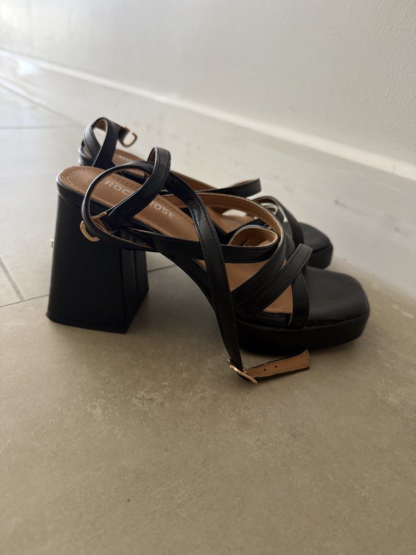 Rock & Rose Black Strappy Block Heels (Category: Heels) located in Makati City. Submitted by cagal.i0n (Listing ID 1470791900, Image 3). Description: - Brand: Rock & Rose - Color: Black with neutral tan inner sole - Style: Chunky block heel with square toe and strappy ankle wrap - Closure: Gold buckle closure - Comfort: Stable and easy to walk in - Occasion: Great for nights out or dressing up casual outfits Original price: 1,799.