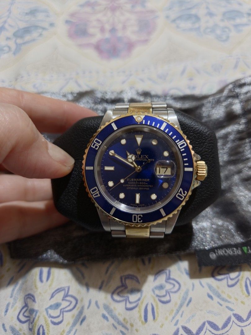 Rolex Submariner Blue Dial Two Tone Watch (Category: Men's Watches) located in Las Pinas. Submitted by swiftdragon_0c099a (Listing ID 1470796347, Image 1). Description: - Model: Rolex Submariner (Two-Tone Steel & Gold) - Dial/Bezel: Stunning blue dial with matching gold bezel - Features: Date window with cyclops lens, iconic Oyster bracelet - Condition: Runs great; shows normal, honest wear from everyday use on the case and band - Inclusions: Com