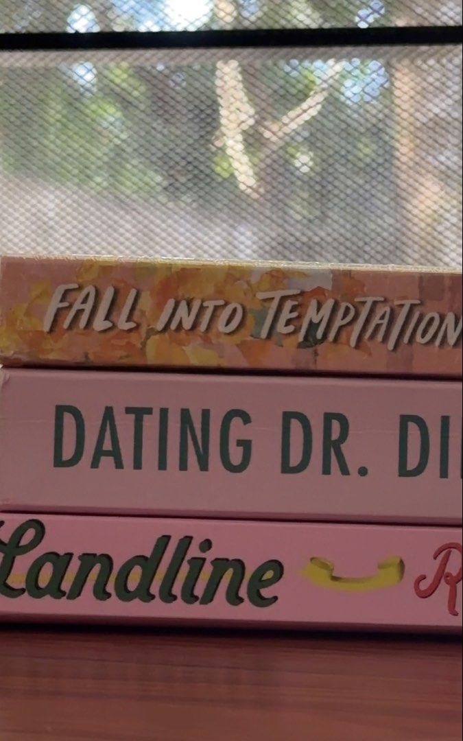 Romance Book Bundle - Landline, Dating Dr. Dil, Fall Into Temptation (Category: Storybooks) located in Calamba. Submitted by sweet_lemonade (Listing ID 1470798714, Image 2). Description: - Bundle of 3 contemporary romance paperbacks - Includes: Landline by Rainbow Rowell, Dating Dr. Dil by Nisha Sharma, and Fall Into Temptation - Condition: One book still brand new and wrapped in plastic, others are clean and well-maintained - Perfect for romance