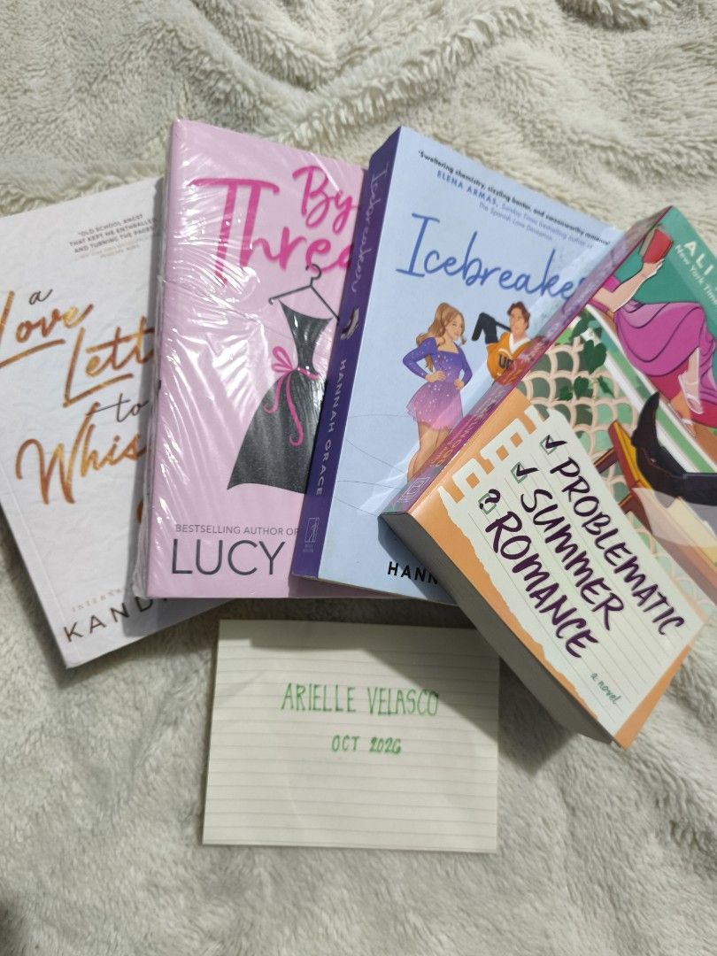 Romance Novels (Category: Storybooks) located in Abucay. Submitted by booksbyjie (Listing ID 1470816268, Image 2). Description: - Romance Novel Collection available individually or as a bundle - A Love Letter to Whiskey by Kandi Steiner (Brand New)- ₱750 - By a Thread by Lucy Score (Brand new) - ₱750 - Icebreaker by Hannah Grace - ₱150 - Problematic Summer Romance by Ali Hazelwood - ₱500 - Individual prices marked on the spine photo - Perfect rea