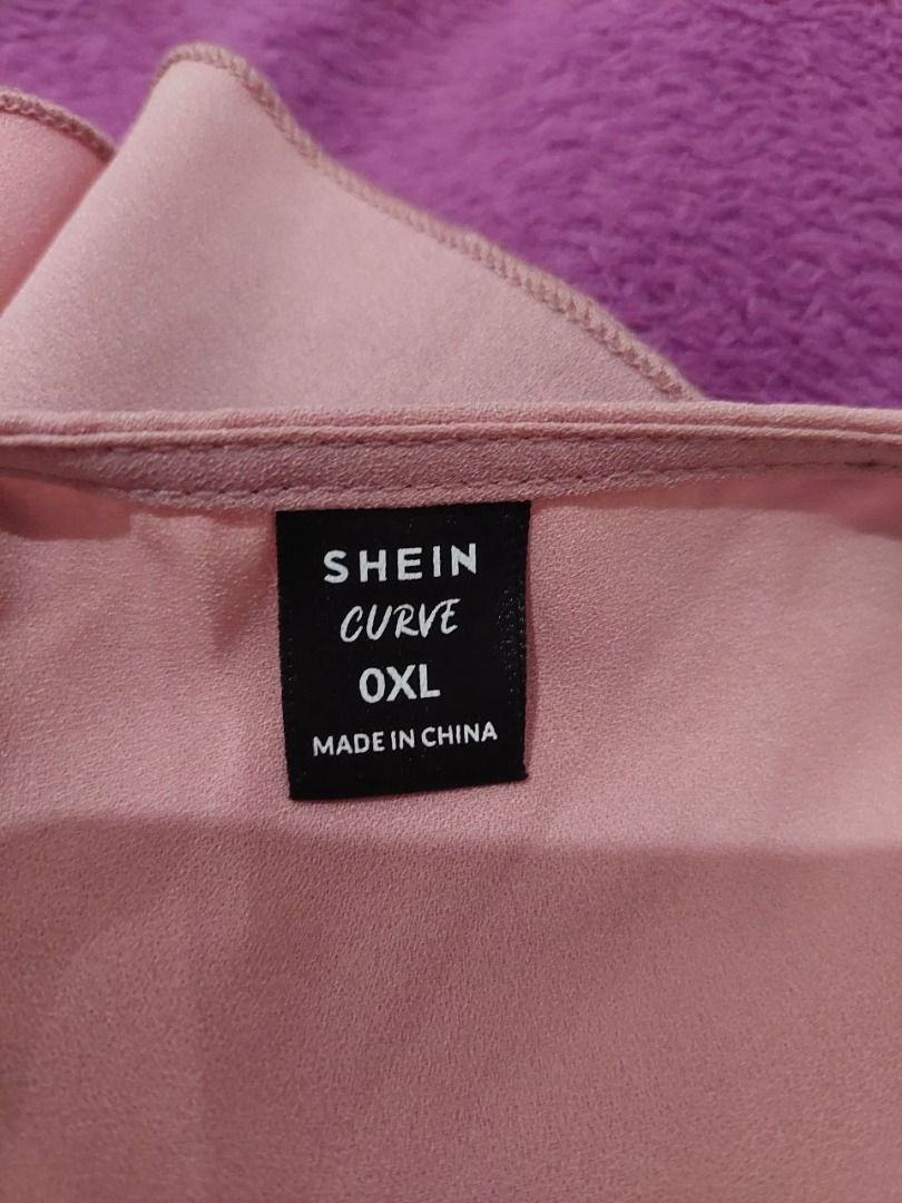 Rose Pink Zip Neck Flutter Sleeve Blouse (Category: Blouses) located in Bulacan. Submitted by nicschill18300 (Listing ID 1470871362, Image 3). Description: - Brand: Shein - Color: Rose pink - Size: XL - Details: Front zipper, cold-shoulder flutter sleeves, curved hemline - Fabric: Lightweight, perfect for warm weather or layering - Styling: Easily pairs with jeans or trousers - Features a V-neckline with a front zipper detail - Short sleeves with