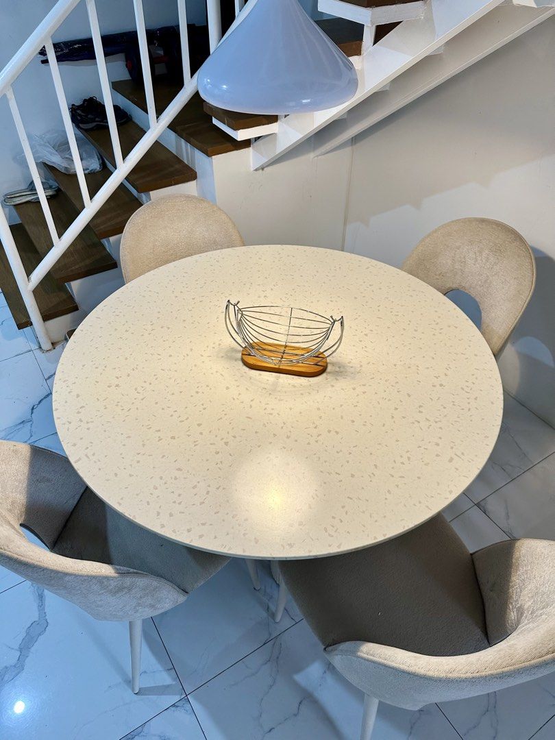 Round Dining Table With Four Upholstered Chairs (Category: Tables & Sets) located in Rizal. Submitted by mendellito (Listing ID 1470890143, Image 3). Description: Kinsley 4-Seater Round Dining Set Pre-loved dining set from Mandaue Foam, perfect for a modern and minimalist home. • 1 round dining table with fluted base • 4 beige upholstered dining chairs • Original price: ₱41,850 • Selling price: ₱25,000 • Condition: Well used 📍 Location: Town & C