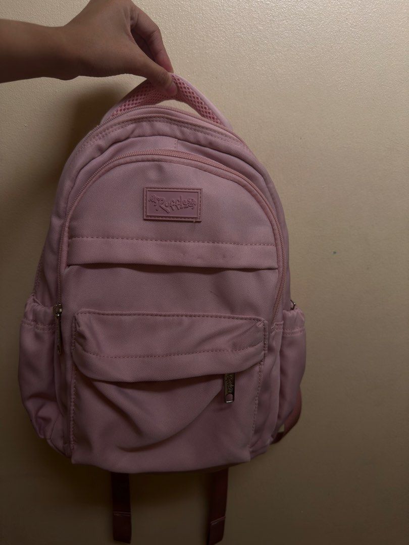 Ruffles pink backpack / school bag (Category: Backpacks) located in Manila. Submitted by epicfalcon.590fae (Listing ID 1470771701, Image 1). Description: - fairly used ruffles bag - can fit up to 13 inch laptop/ipad - no issues aside from the pin marks on the front.