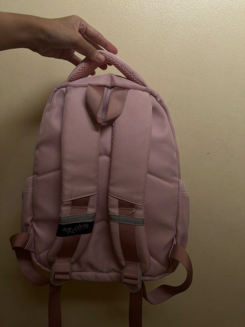 Ruffles pink backpack / school bag (Category: Backpacks) located in Manila. Submitted by epicfalcon.590fae (Listing ID 1470771701, Image 2). Description: - fairly used ruffles bag - can fit up to 13 inch laptop/ipad - no issues aside from the pin marks on the front.