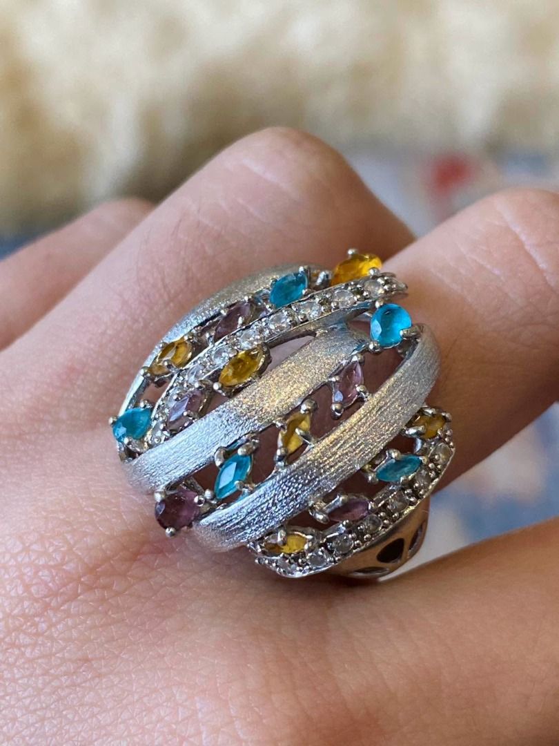 S7.5 VINTAGE CHUNKY MULTIGEM SILVER RING (Category: Rings) located in Baguio. Submitted by asna_taku (Listing ID 1470819667, Image 2). Description: ✨💎 VINTAGE CHUNKY MULTIGEM SILVER RING 💎✨ A stunning statement piece bursting with colors and vintage elegance! 🌈💖 Beautifully designed with vibrant blue, golden-yellow, and purple gemstones, complemented by sparkling accent stones. Its bold, intertwined silver bands feature a gorgeous textured fi