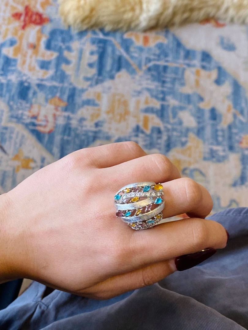 S7.5 VINTAGE CHUNKY MULTIGEM SILVER RING (Category: Rings) located in Baguio. Submitted by asna_taku (Listing ID 1470819667, Image 1). Description: ✨💎 VINTAGE CHUNKY MULTIGEM SILVER RING 💎✨ A stunning statement piece bursting with colors and vintage elegance! 🌈💖 Beautifully designed with vibrant blue, golden-yellow, and purple gemstones, complemented by sparkling accent stones. Its bold, intertwined silver bands feature a gorgeous textured fi