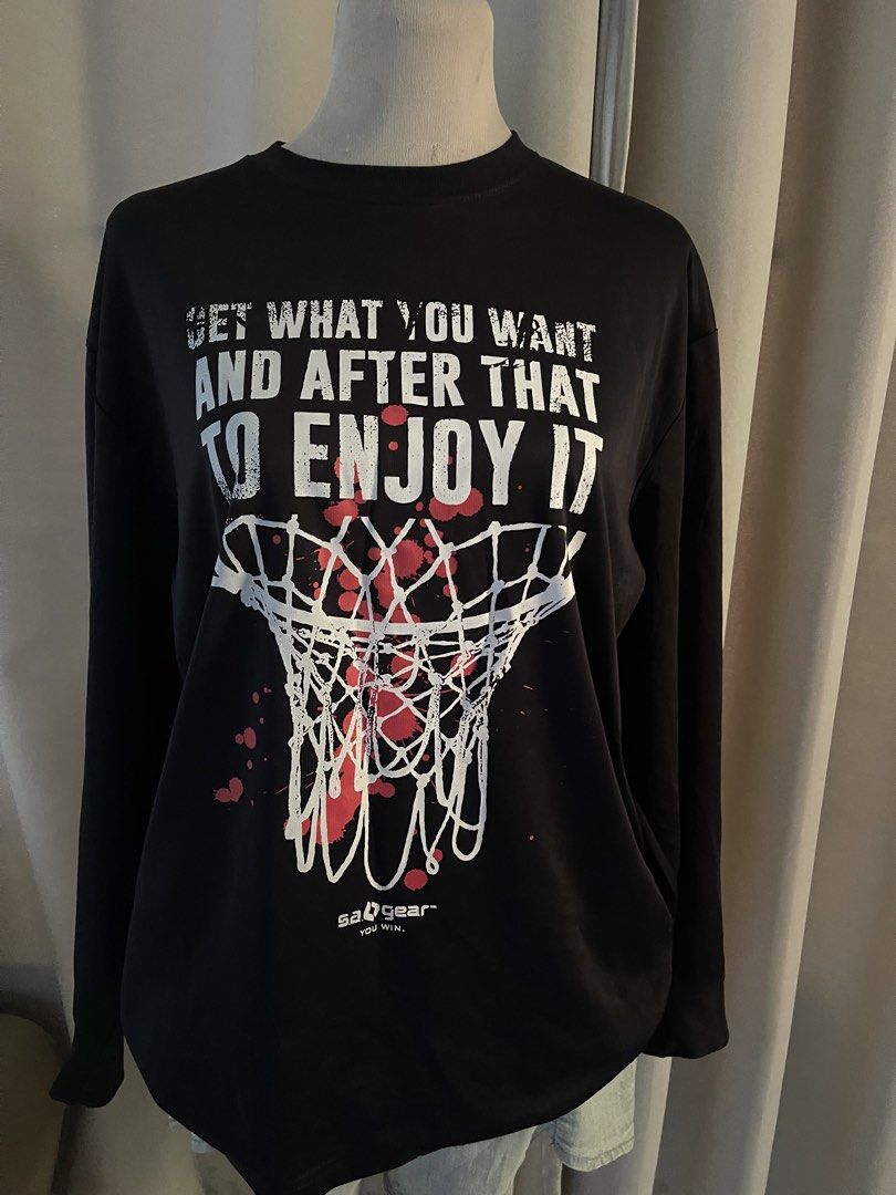 Sa Gear Basketball drifit (Category: Activewear) located in Cainta. Submitted by zlove111 (Listing ID 1470789810, Image 1). Description: - Brand: SA Gear - Style: Black long-sleeve crewneck shirt with a relaxed fit - Design: Large basketball net graphic with red splatters and motivational quote on the front - Details: Brand logo printed near the bottom hem - Material: Comfortable, high-quality fabric - Condition: Excellent / Pre-loved (manage exp