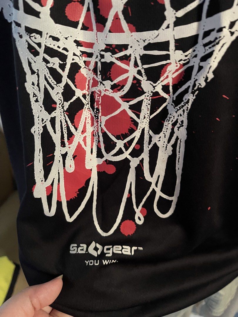 Sa Gear Basketball drifit (Category: Activewear) located in Cainta. Submitted by zlove111 (Listing ID 1470789810, Image 3). Description: - Brand: SA Gear - Style: Black long-sleeve crewneck shirt with a relaxed fit - Design: Large basketball net graphic with red splatters and motivational quote on the front - Details: Brand logo printed near the bottom hem - Material: Comfortable, high-quality fabric - Condition: Excellent / Pre-loved (manage exp
