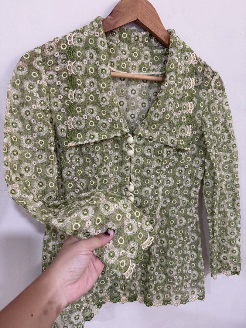 Sage Olive green Top floral eyelet (Category: Longsleeves) located in Manila. Submitted by morningthrifters (Listing ID 1470891661, Image 3). Description: 📝 green long-sleeved button-down jacket or blouse featuring a repeating floral lace or eyelet pattern with a large collared neckline and scalloped trim. 📍Pateros Metro Manila 🚚 Jnt / Lalamove / Pickup 📐 Size small 💗 Second time buyers has a free item, follow me to get updated. ⚠️ Please ma