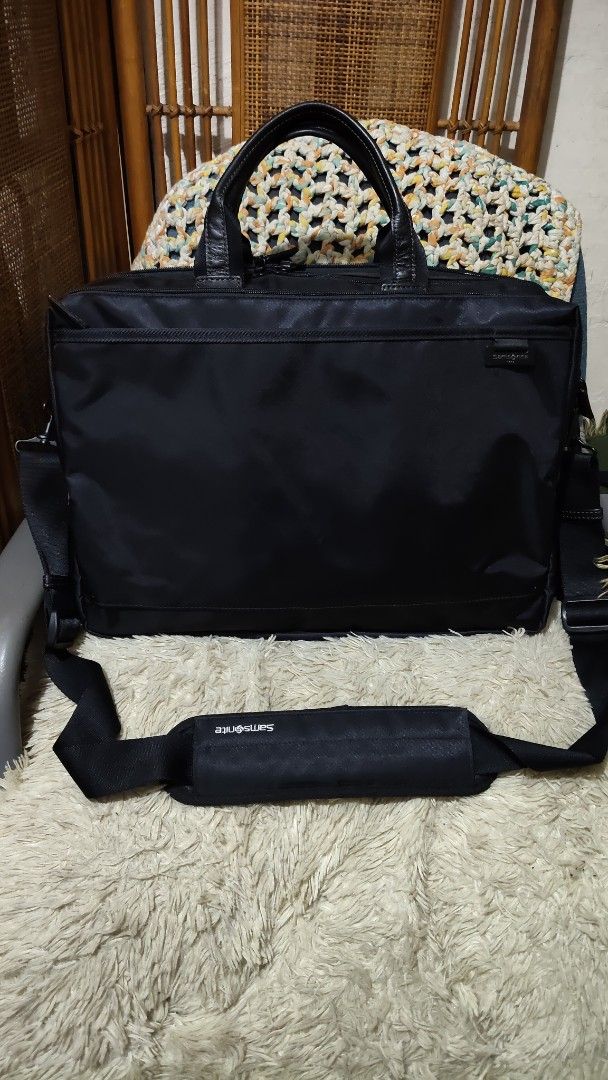 Samsonite Black Laptop Briefcase Shoulder Bag (Category: Briefcases) located in Cebu City. Submitted by lumaynojes00490 (Listing ID 1470829165, Image 1). Description: - Brand: Samsonite - Color: Classic Black - Material: Durable nylon with genuine leather handles - Storage: Spacious zippered main compartments plus a front pocket for quick access - Comfort: Includes an adjustable shoulder strap with a branded padded grip - Condition: Clean exterio